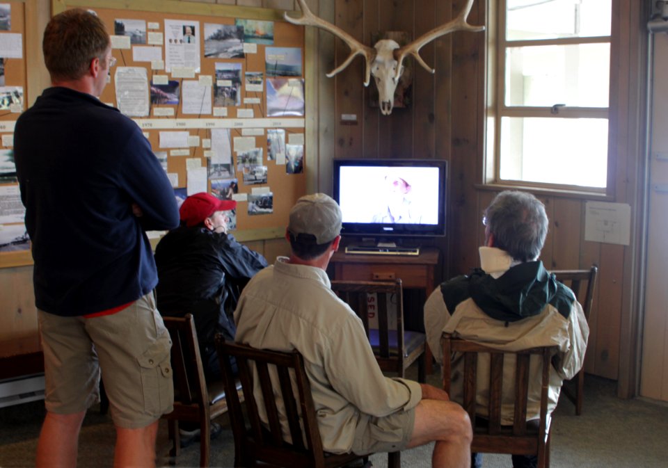 Bridge Bay Ranger Station visitors watching backcountry video