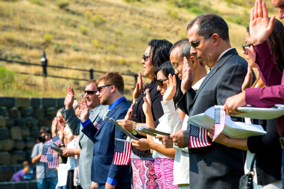 Applicants take the Oath of Allegiance at a naturalization ceremony