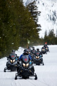 Guided snowmobile group on the West Entrance Road