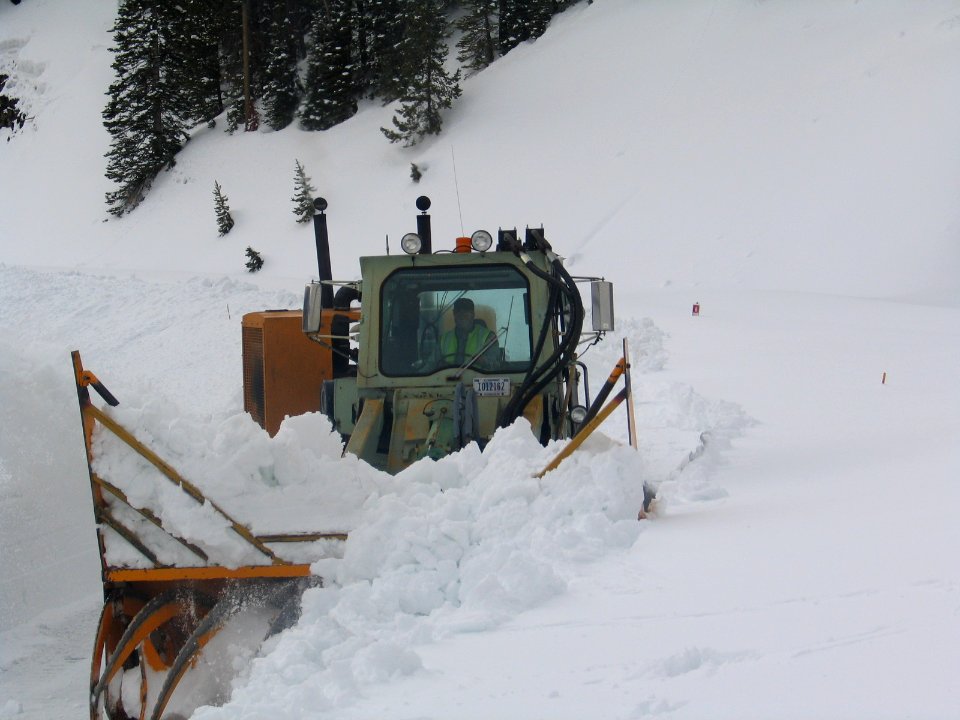 Brett Athas in the Hough loader pushing snow that's above the head