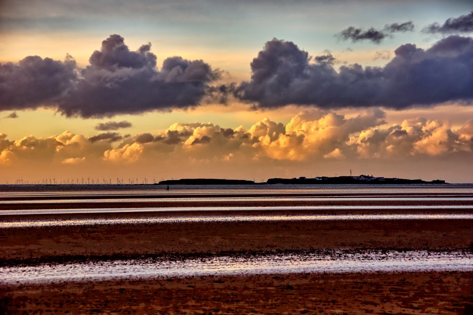 01 Hilbre Islands Walking the dog as storm clouds gather
