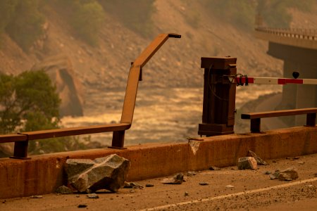 Damage to the guard rail on the south side of the eastbound lanes at Exit 121