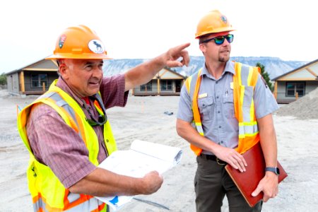 Kyle Stone, Civil Engineer, going over plans with a consulting building inspector at the YACC Camp project site