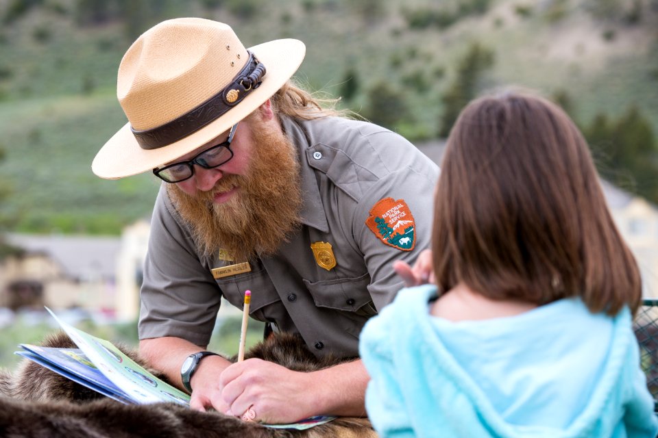 Signing a junior ranger booklet, Mammoth Hot Springs
