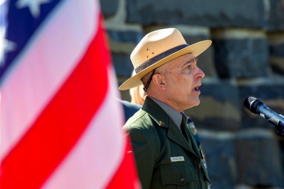 Ranger Breis sings the National Anthem at the 2018 Naturalization Ceremony in Mammoth Hot Springs