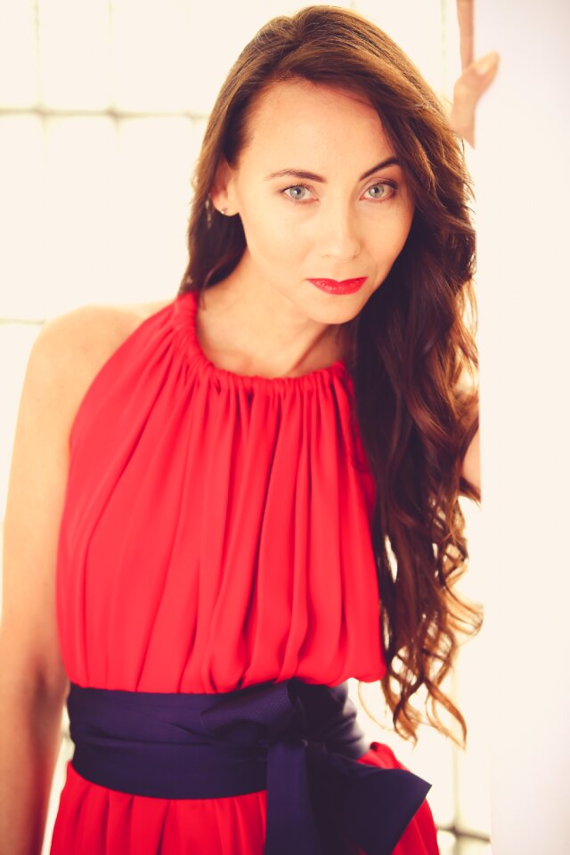 A beautiful woman long hair red dress
