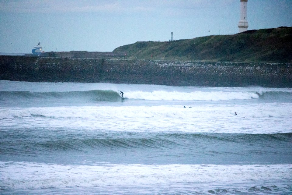 Surfers on Aberdeen Harbour in the Evening