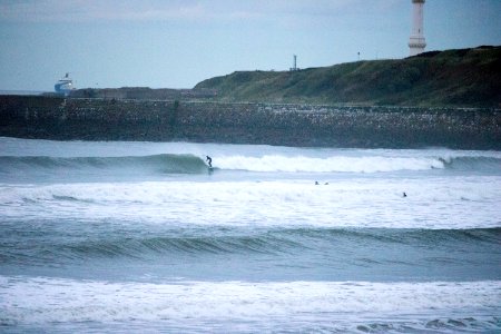 Surfers on Aberdeen Harbour in the Evening photo