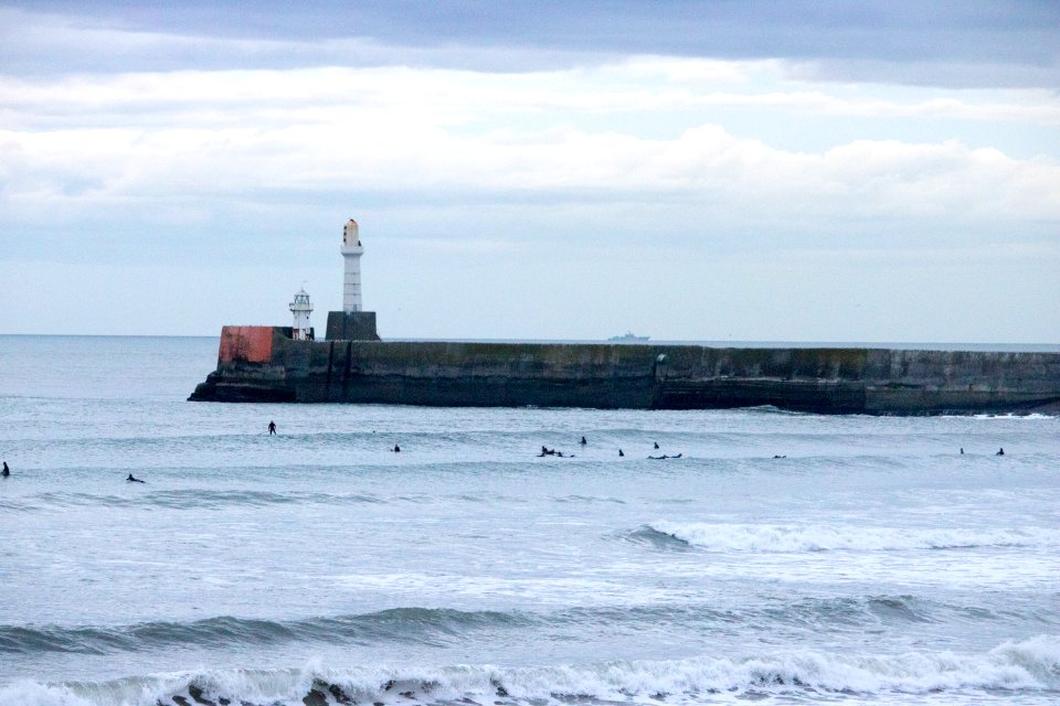 Surfers on Aberdeen Harbour in the Evening