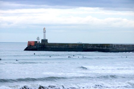 Surfers on Aberdeen Harbour in the Evening photo