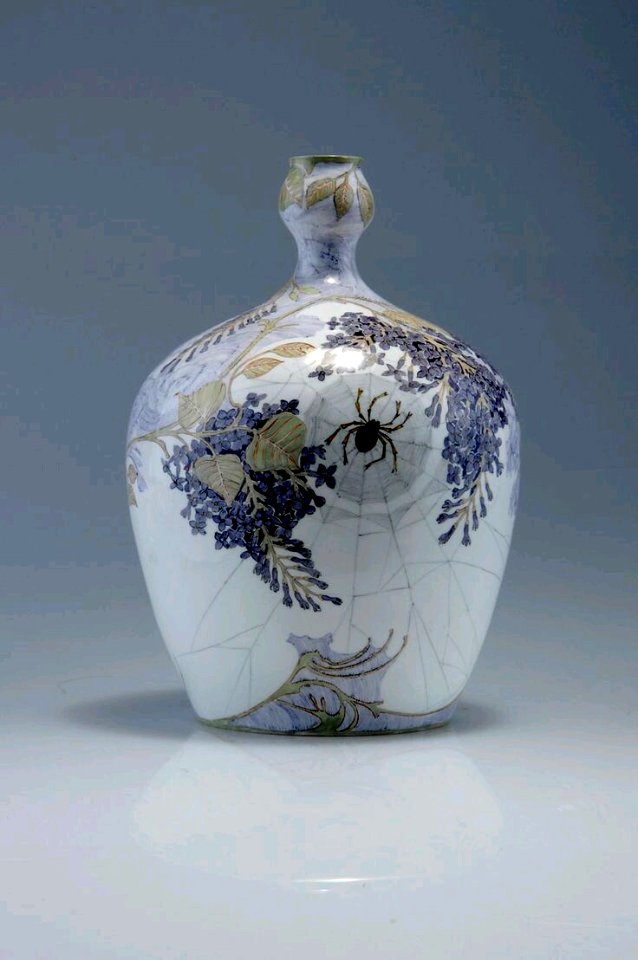 Haagsche Plateelbakkerij Rozenburg. Vase with two spiders in their webs, 1902. Eggshell porcelain, white, painted dark-purple and green by Samuel Schellink H. 23 cm