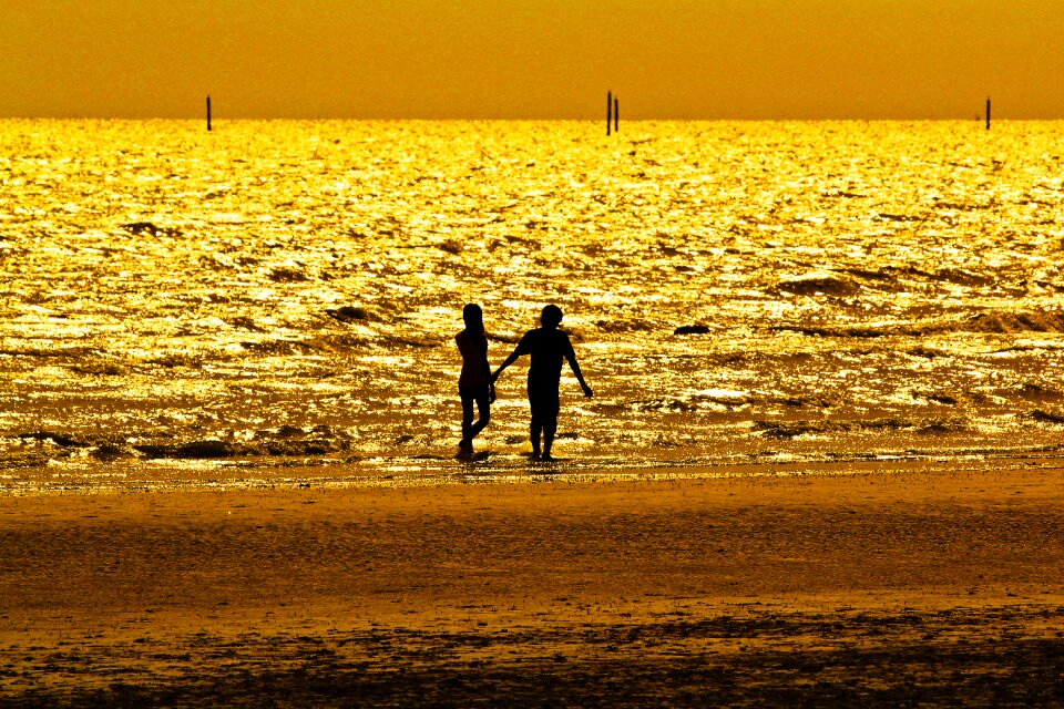 Couple pictures beach hand in hand