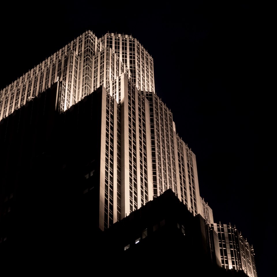 Dramatically lit art deco building (Wells Fargo Center) in Minneapolis