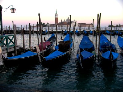 Venice sunset and gondolas photo