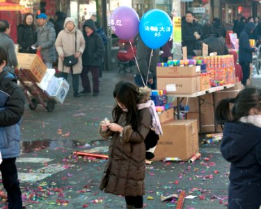 Girl on the sidelines at lunar new year parade photo