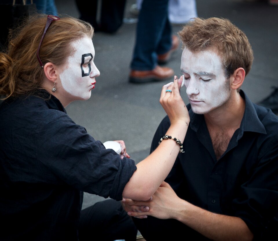 Performers make up costumes