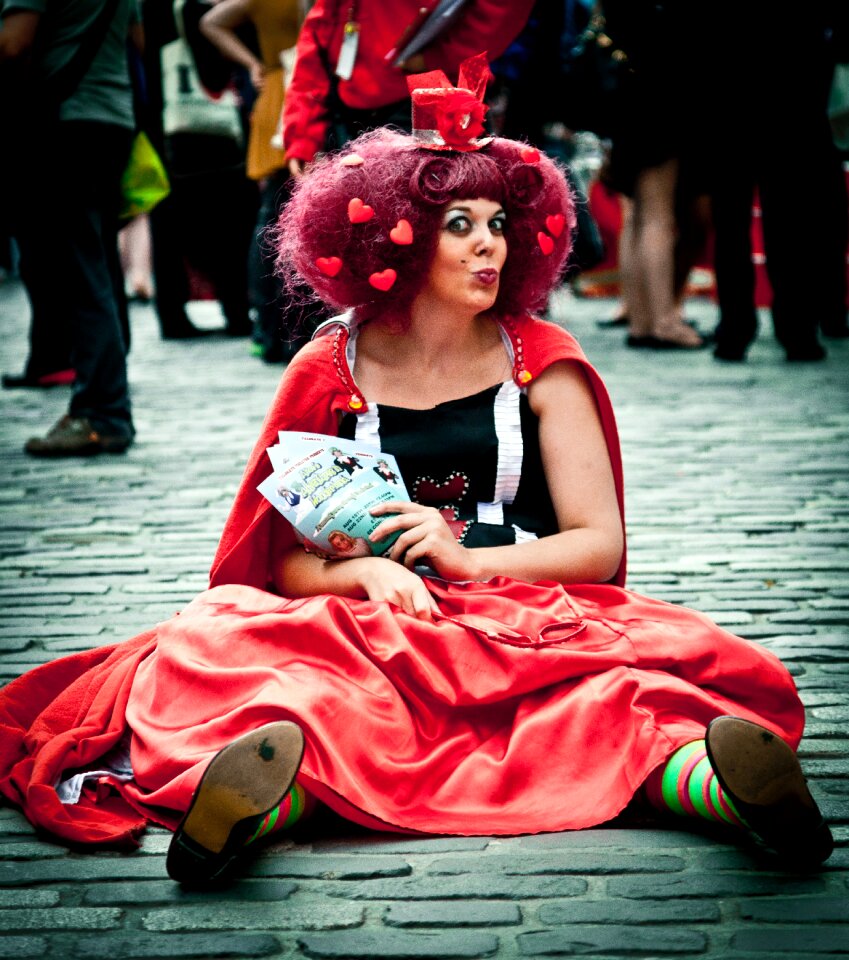Performers make up costumes