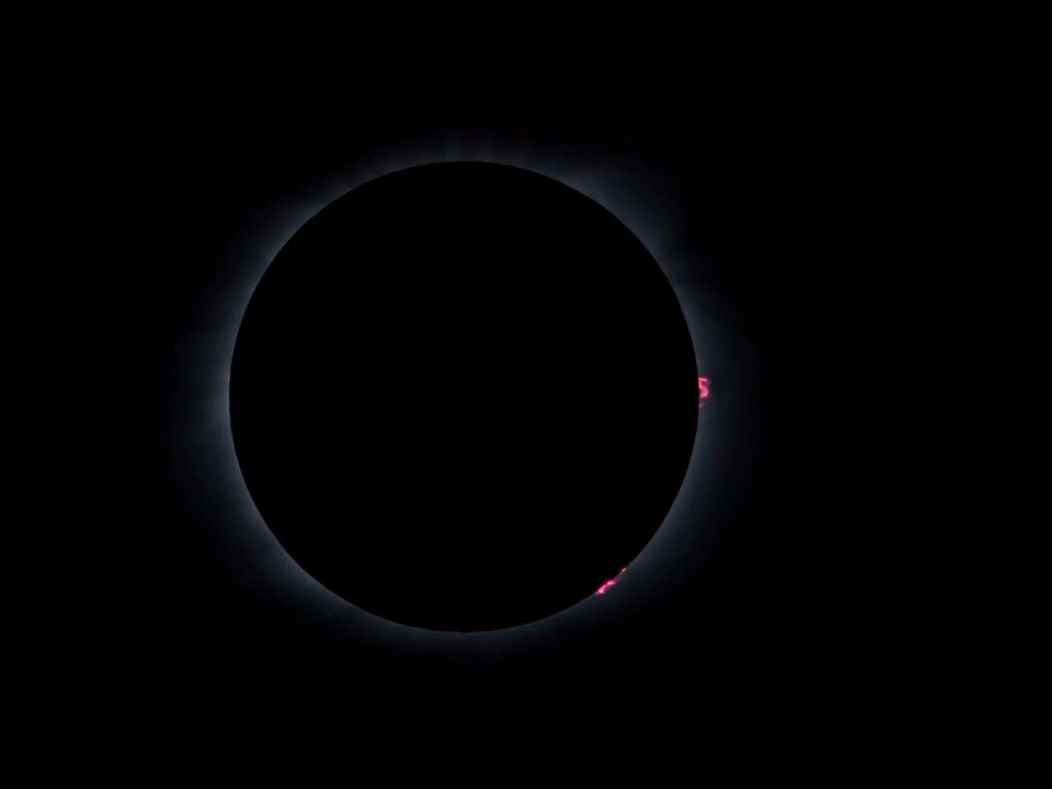 Solar prominences from behind moon