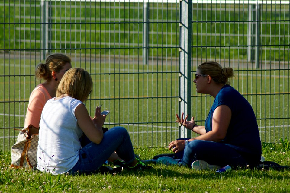 Women exchange sitting