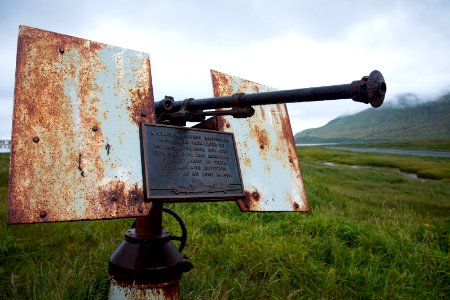 Memorial plaque on anti-aircraft gun above Massacre Bay, Attu