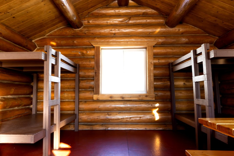 Interior of a log public use cabin.