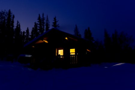 Cozy cabin at night