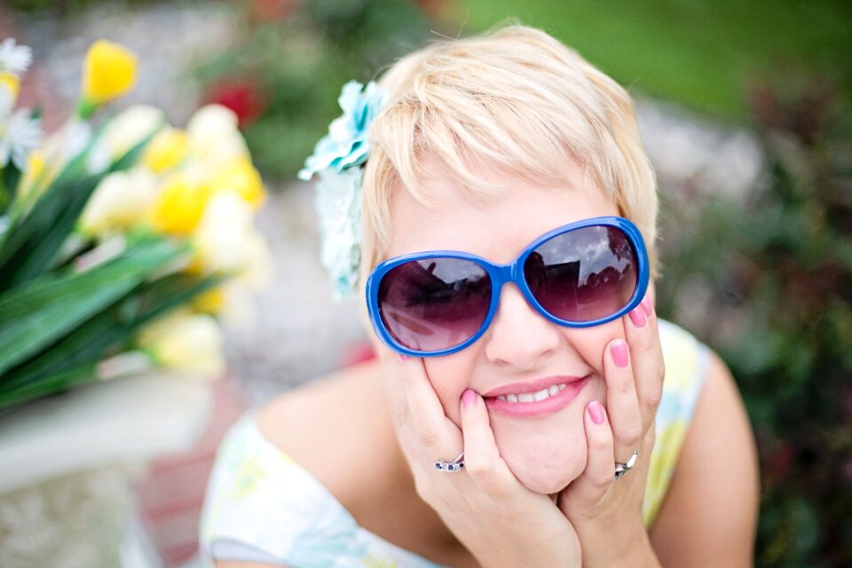 Pretty young woman happy shades