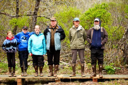 Volunteers and observers checking mistnets during bird banding photo