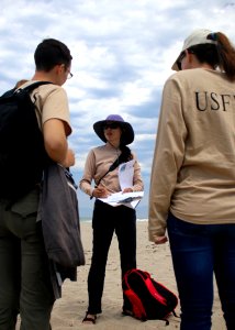 Lena Chang, senior fish and wildlife biologist with the Service in Ventura, and volunteer coordinator for the South Coast Chapter of BeachCOMBERS, discusses BeachCOMBERS protocol with other Service biologists. photo