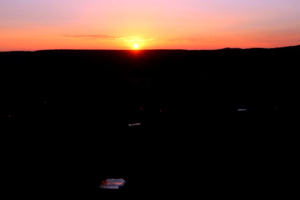 Acclimation cages in the sunset photo