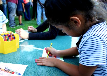 Ojai, Calif. (March 18, 2017) - A young visitor colors a seed packet to hold native pollinator seeds during an event at the Libbey Bowl celebrating women in science, and longtime condor advocate Jan Hamber.