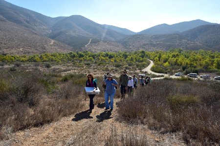 Hiking into the release site with Quino larvae
