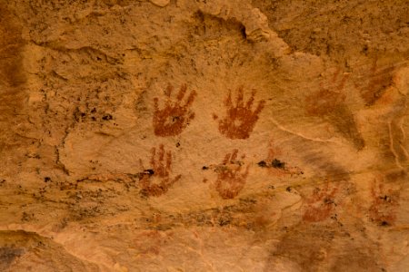 Hand depictions on wall of cave photo