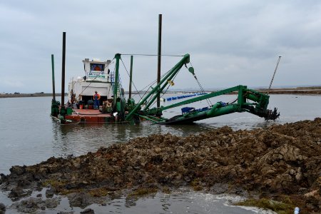 Trash clogging the dredge cutter head during the restoration project
