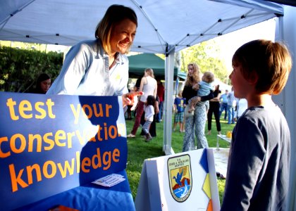 Ojai, Calif. (March 18, 2017) - Ventura Fish and Wildlife Office public affairs officer Ashley Spratt tests a visitor's conservation knowledge during an event at the Libbey Bowl celebrating women in science, and longtime condor advocate Jan Hamber.