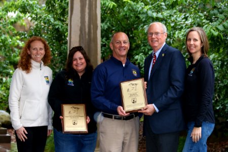 Santa Barbara Zoo Conservation and Research team accepts award from U.S. Fish and Wildlife Service Field Supervisor Steve Henry for Zoo's commitment to the recovery of rare wildlife.