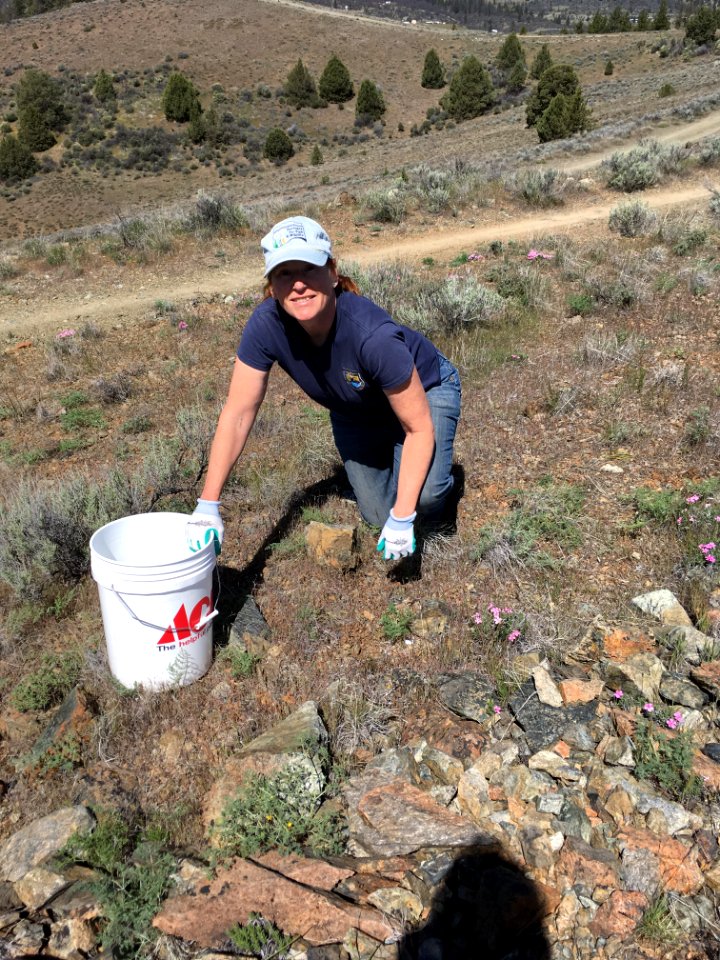 Yreka Fish and Wildlife Office’s Sheri Hagwood helping to pickup broken glass on China Hill
