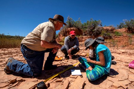 BLM Paleontologist Dr. Greg McDonald assists with track documentation. Moab, UT. Photo by Eric Delphenich