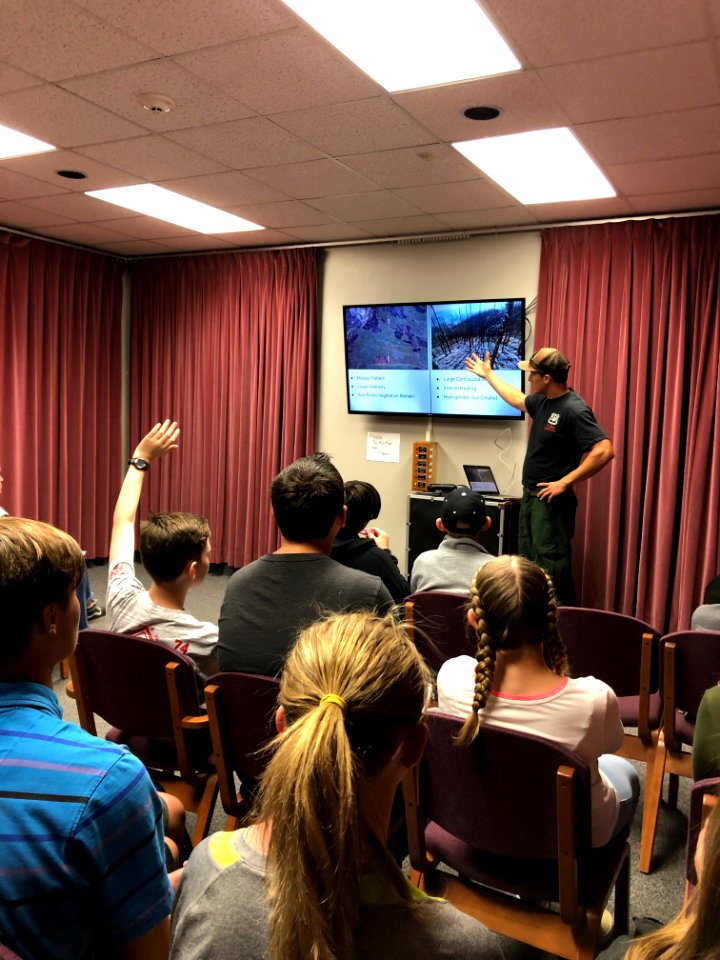 Wildland Firefighter Mac Zimmerman described fire ecology and fire program careers at Flaming Gorge STEM Day. Flaming Gorge Dam, UT. Photo by BLM Utah