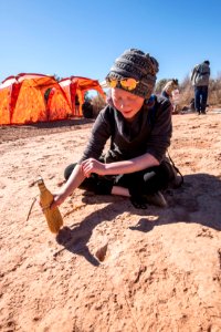 Describing the dino tracks at SLCSE Paleo Camp. Moab, UT. Photo by Eric Delphenich