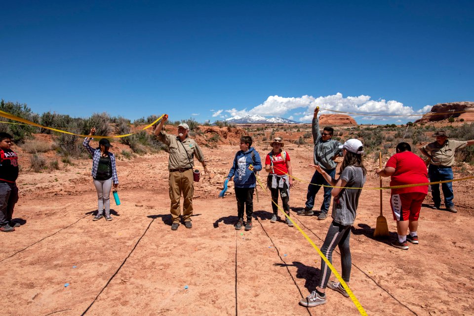 BLM Paleontologist Brent Breithaupt shows students how to take site measurements. Moab, UT. Photo by Eric Delphenich