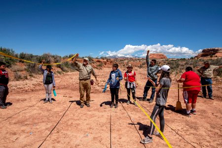 BLM Paleontologist Brent Breithaupt shows students how to take site measurements. Moab, UT. Photo by Eric Delphenich