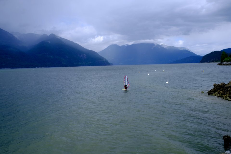 Windsurfer w hydrofoil on a stormy day