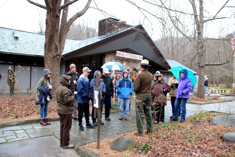 Ranger Brad Free talks to visitors outside Sugarlands Visitor Center before the Christmas Memories Walk Volunteer Frances Hensley on the Christmas Memories Walk at the 2018 Festival of Christmas Past, December 8, 2018--Warren Bielenberg