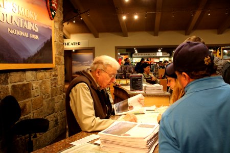 Volunteer Merwyn Borders assists visitors at the 2018 Festival of Christmas Past, December 8, 2018--Warren Bielenberg