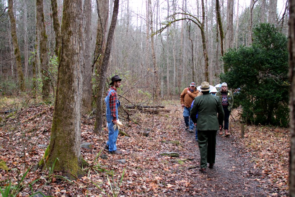 Intern Zack Curtis and Volunteer Grant Palmer (as first park superintendent Ross Eakin) with visitors on the Christmas Memories Walk, Festival of Christmas Past, December 8, 2018--Warren Bielenberg