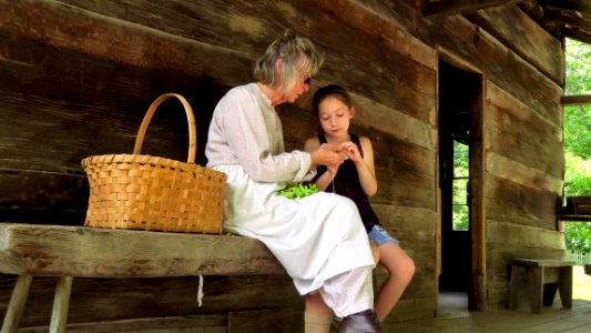 Ann Hill helping a young visitor, June 2018--Shannon Welch