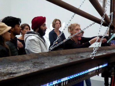 Looking at a burning artwork