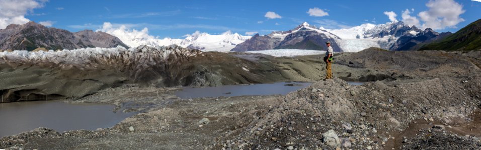 Hiker viewing Kennicott Glacier near Wilderness Boundary - Donoho Basin photo