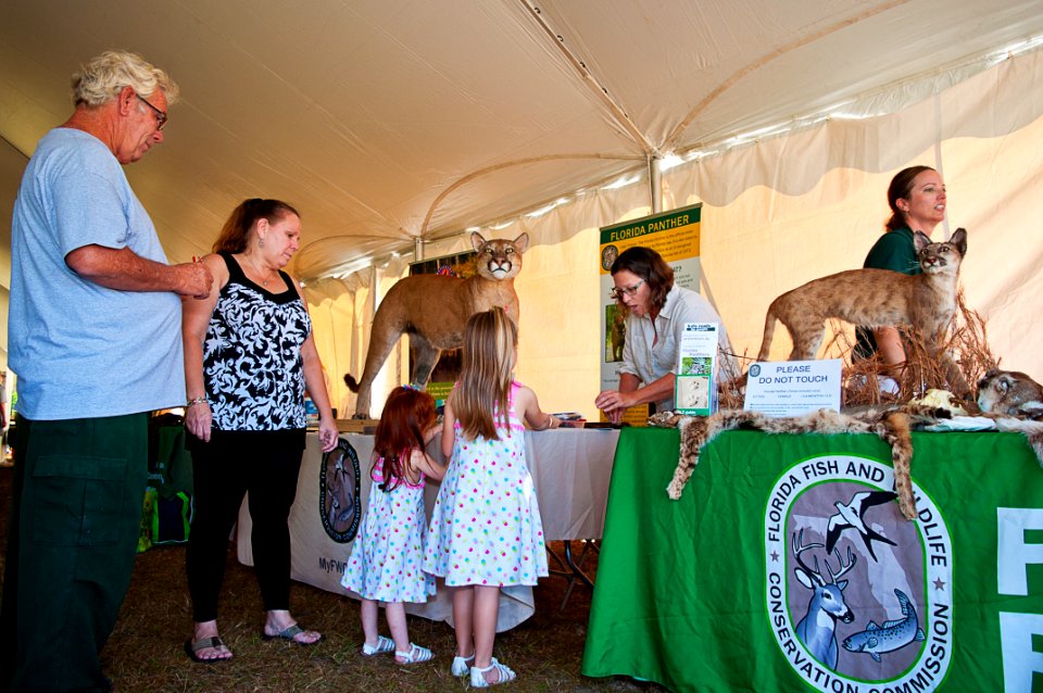 From left, Dave, Kim, Delilah and Leah talking with Jayne of the Florida Fish and Wildlife Conservation Commission with Jennifer at work in the background